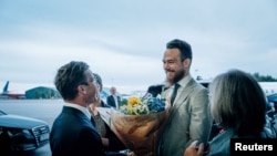 FILE - Johan Floderus, after being imprisoned in Iran, is greeted by Swedish Prime Minister Ulf Kristersson at Arlanda Airport, in Stockholm, June 15, 2024. (TT News Agency/Tom Samuelsson / Regeringkansliet via Reuters)