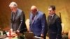 U.N. Secretary-General António Guterres, left, stands during a moment of silence during a United Nations General Assembly tribute to the late Iranian President Ebrahim Raisi at U.N. headquarters in New York on May 30, 2024. 