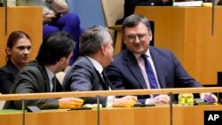 Dmytro Kuleba, Ukraine's foreign minister, right, and Sergiy Kyslytsya, permanent representative of Ukraine to the U.N., react after the U.N. General Assembly voted in favor of a resolution supporting Ukraine, Feb. 23, 2023, at U.N. headquarters.