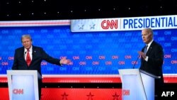 ABŞ Prezidenti Co Bayden və keçmiş ABŞ Prezidenti, Respublikaçılar partiyasından prezidentliyə namizəd Donald Tramp ilk debatda iştirak edir. 27 iyun, 2029.