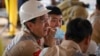 资料照片: 2023年1月24日中国海洋石油总公司的中国工人参加乌干达油田钻井启动仪式
