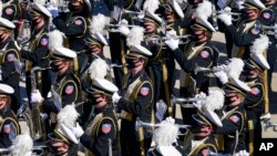FILE - The Purdue University Marching Band plays with facemasks in place before the start of the Indianapolis 500 auto race at Indianapolis Motor Speedway in Indianapolis, May 30, 2021.