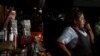 FILE - A saleswoman waits for customers at her stand during a power cut, in Quito, Ecuador, April 18, 2024. The entire country lost power on June 19, 2024, for periods of time due to production problems.