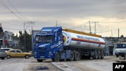 A truck carrying fuel crosses into Rafah in the southern Gaza Strip, Nov. 15, 2023. The United Nations agency for supporting Palestinian refugees said the fuel was "not at all enough." 