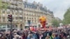 Thousands joined the traditional International Workers' Day protest in Paris, canceled last year because of coronavirus, May 1, 2021. (Lisa Bryant/VOA)