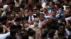 Shehbaz Sharif, brother of former Prime Minister Nawaz Sharif and leader of Pakistan Muslim League-Nawaz (PML-N), walks with lawyers and supporters after the High Court rejected a bail plea in a money laundering case in Lahore, Pakistan, Sept. 28, 2020.