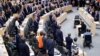 Members of the Parliament stand during a session of the Parliament in Vienna, Austria, May 27, 2019.