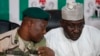 Brig. Gen. Chris Olukolade, Nigeria's top military spokesman, left, talks with Director General, National Orientation Agency, Mike Omeri, during a press conference on the abducted school girls in Abuja, Nigeria, May 12, 2014. 