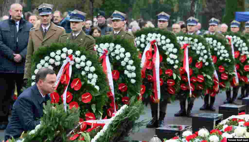 President Andrzej Duda (L) lays a wreath at the graves of the Presidential plane crash victims during a ceremony marking the 6th anniversary of the crash, at the Powazki Military Cemetery in Warsaw, Poland. President Lech Kaczynski, his wife Maria Kaczynska and 94 others died on 10 April 2010 when Polish presidential plane crashed in Smolensk, Russia. 