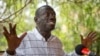 Opposition leader and presidential candidate Kizza Besigye speaks to the media while under continued house arrest at his home in Kasangati, outside the capital Kampala in Uganda, Feb. 21, 2016. 