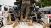 Members of the United Nations Organization Stabilization Mission in the Democratic Republic of the Congo ride on a pickup as they secure the evacuation of non-essential UN staff in Goma, Congo, Jan. 25, 2025.
