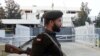FILE - A Pakistani soldier stands guard in front of the Indian High Commission in Islamabad, Feb. 8, 2003. 