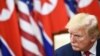 도널드 트럼프 미국 대통령이 지난 6월 판문점 회동에서 김정은 북한 국무위원장의 발언을 듣고 있다.