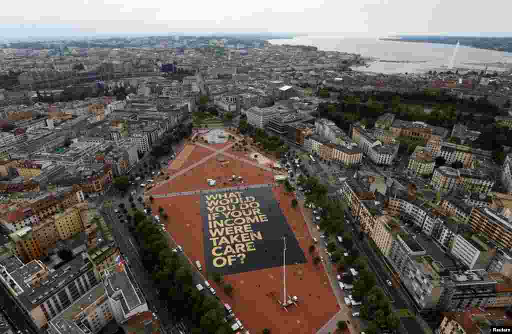 A 8,000 square meter poster is pictured on the Plainpalais square in Geneva, Switzerland May 14, 2016. 