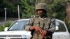FILE - A soldier stands guard on a street in Yaounde, Cameroon, Jan. 28, 2022.
