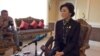 Thailand's caretaker Prime Minister Yingluck Shinawatra speaks to members of the foreign media in Bangkok, Dec. 11, 2013. (Steve Herman/VOA)