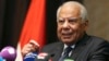 FILE - Egypt's Prime Minister Hazem el-Beblawi gestures during a news conference in Abu Dhabi, Oct. 27, 2013. 