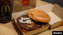 FILE - A McDonald's Quarter Pounder hamburger and drink are seen in an illustration picture taken in New York City, October 24, 2024. 