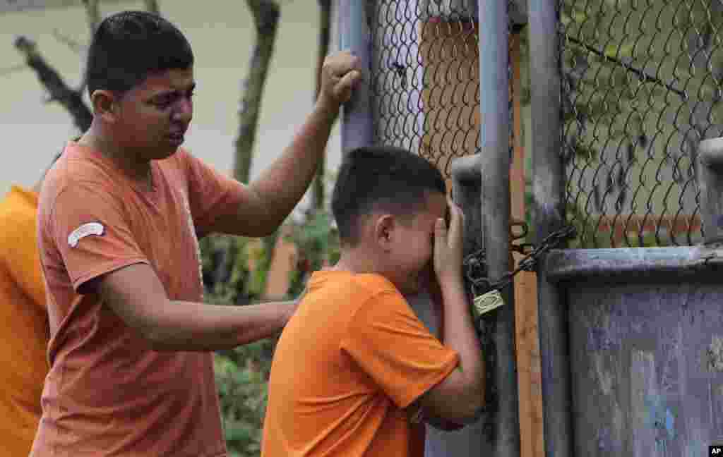 Boys cry as they find out that their sister has been killed in an earthquake in Pedernales, Ecuador.&nbsp;The &nbsp;7.8-magnitude earthquake flattened buildings and buckled highways along its Pacific coast, sending the Andean nation into a state of emergency.