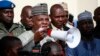Borno state governor, Kashim Shettima (c), addresses demonstrators who were calling on the government to rescue the kidnapped schoolgirls of the Chibok secondary school, in Abuja, Nigeria, May 13, 2014.