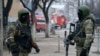 FILE - Russian special forces soldiers wear masks during an anti-terrorist operation in Makhachkala, Dagestan, Russia, Jan. 20, 2014. Dagestan province in the North Caucasus has been feeding hundreds of fighters to the Islamic State in Syria, officials say.