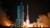 A Long March rocket with a Shenzhou-19 spacecraft atop takes off from the Jiuquan Satellite Launch Center in Jiuquan, northwestern China in the early hours of Oct. 30, 2024.