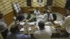 Egyptian elections officials count ballots at a polling center during the second day of the presidential runoff, in Cairo, Egypt, Sunday, June 17, 2012.