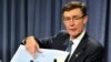 Angus Houston, head of the Australian agency coordinating the search for missing Malaysian Airlines Flight MH370, points to a map as he speaks during a news conference in Perth, April 7, 2014.