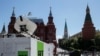 FILE - Vehicles of Russian state-controlled broadcaster RT are seen near Red Square in central Moscow, Russia, June 15, 2018.