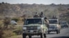 Des soldats du gouvernement éthiopien sur une route près d'Agula, au nord de Mekele, dans la région de Tigray, dans le nord de l'Éthiopie, le 8 mai 2021 . 