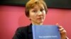 Marina Litvinenko, widow of slain ex-KGB agent Alexander Litvinenko, poses with a copy of The Litvinenko Inquiry Report during a news conference in London, Jan. 21, 2016. 