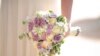 In this Thursday, Dec. 14, 2017 photo, a bride holds a bouquet during her wedding in Ein Hemed. A growing number of Israeli couples are defying the country’s Chief Rabbinate and marrying in unsanctioned weddings. The couples include people who have…