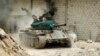 A military vehicle that belongs to the Free Syrian Army is seen in Al-Amariya district in Aleppo, May 8, 2014.