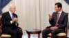 FILE - Syrian President Bashar Assad (R) speaks with United Nations special envoy on Syria Staffan de Mistura, in Damascus, Nov. 10, 2014.