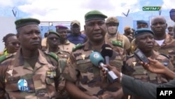 This video grab obtained by AFPTV from Office de Radiodiffusion-Télévision du Mali (ORTM) on September 17, 2024 shows Mali's army chief of staff Oumar Diarra (C) speaking to the media in Bamako.