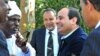 FILE - Former military chief Abdel Fattah el-Sissi (center right) speaks to members of the Nubian community in Cairo.