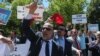 Supporters of Turkish President Recep Tayyip Erdogan react to anti-Erdogan supporters outside the White House in Washington, D.C., May 16, 2017. Erdogan was meeting with U.S. President Donald Trump.