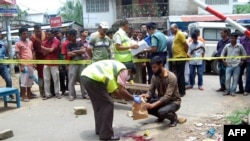 Bangladesh forensics police investigate the site where blogger Ananta Bijoy Das was hacked to death, in Sylhet on May 12, 2015. 