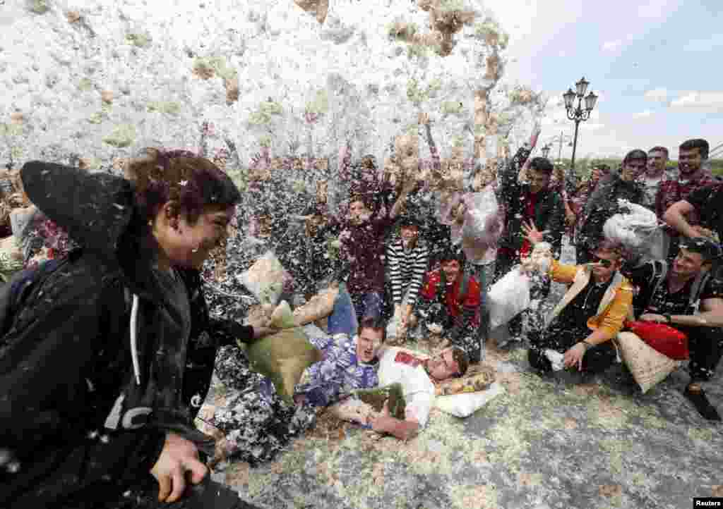 People take part in a pillow fight during a flash mob in Kyiv, Ukraine.