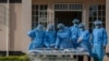 Medical personnel dressed in personal protective equipment are waiting their turn to work inside the COVID-19 treatment center at Kamuzu Central Hospital in Lilongwe, Malawi, on Jan. 18, 2021.