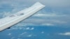 ເຮືອ​ບິນສອດ​ແນມ P-8A Poseidon ຂອງ ສະ​ຫະ​ລັດ ບິນ​ຢູ່​ໃກ້​ກັບ​ໂຄ​ງ​ສ້າງ ແລະ ຕຶກ​ຂອງ ຈີນ ຢູ່​ເກາະ​ທຽມ Fiery Cross Reef ໃນ​ໝູ່​ເກາະ Spratly ໃນ​ທະ​ເລຈີນ​ໃຕ້, 20 ມີ​ນາ 2022.