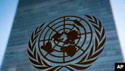 FILE - The symbol of the United Nations is displayed outside the Secretariat Building, Feb. 28, 2022, at United Nations headquarters.