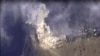 This photo made from footage taken from the Russian Defense Ministry website Nov. 2, 2015, shows a Russian airstrike hitting a target in Syria. The Russian Defense Ministry said the strike was performed by an Su-34M bomber in Aleppo province. 