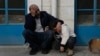 Mourners wait outside a morgue for the funeral of six Palestinians killed during an Israeli airstrike on Wednesday in the West Bank refugee camp of Jenin, Jan. 16, 2025.