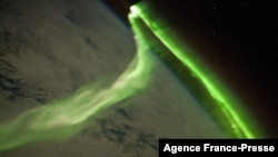 FILE - This NASA image released June 21, 2010, shows the Aurora Australis observed from the International Space Station May 29, 2010. The image was taken during a geomagnetic storm.