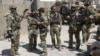 FILE - U.S. special forces soldiers consult before leaving their base in Helmand, Afghanistan Sept. 28, 2015. 