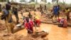 Gold miners work at a mining site in the Cameroon town of Betare Oya, April 4, 2018.