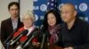 Family members watch as Kenneth Bae, right, freed during a top-secret mission, talks to reporters after he arrived at Joint Base Lewis-McChord, Washington, Nov. 8, 2014.