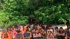 FILE - Rohingya sits on a beach at Rawi island in Satun province Southern of Thailand Tuesday, June 11, 2019. Thai officials say they have discovered 65 ethnic Rohingya Muslim refugees who were shipwrecked and stranded in southern Thailand.