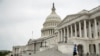 A man wearing a mask jogs past the U.S. Capitol Building, April 28, 2020, in Washington.